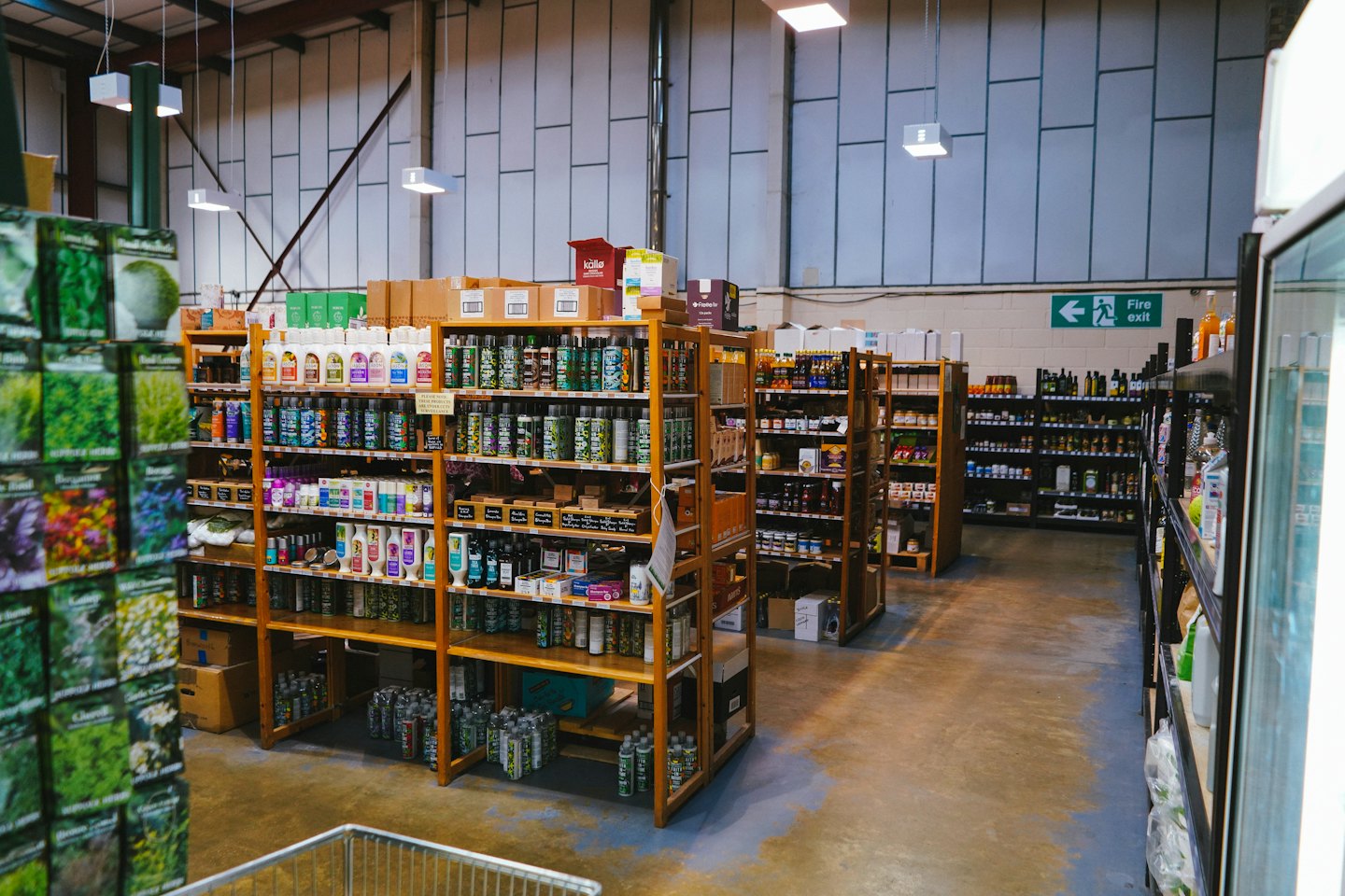 Organic products stocked on wooden shelves in a retail store.